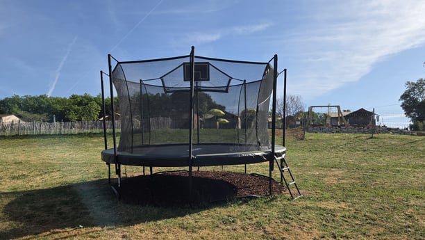 Trampoline with basketball hoop