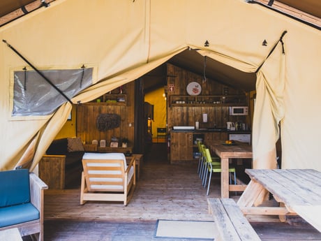 Peek inside. Enjoy the seamless connection between outdoor beauty and cozy indoor living—your glamping retreat awaits.