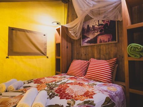 A comfortable double bed awaits in its own private room, offering a peaceful space to rest and recharge during your stay.