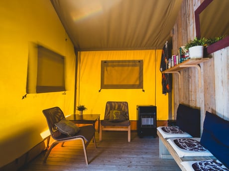 At the front of the lodge, you’ll find a welcoming living room — the perfect place to relax on cooler nights and enjoy the cozy atmosphere indoors
